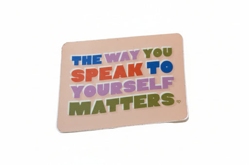 Colorful motivational card with text on a textured surface